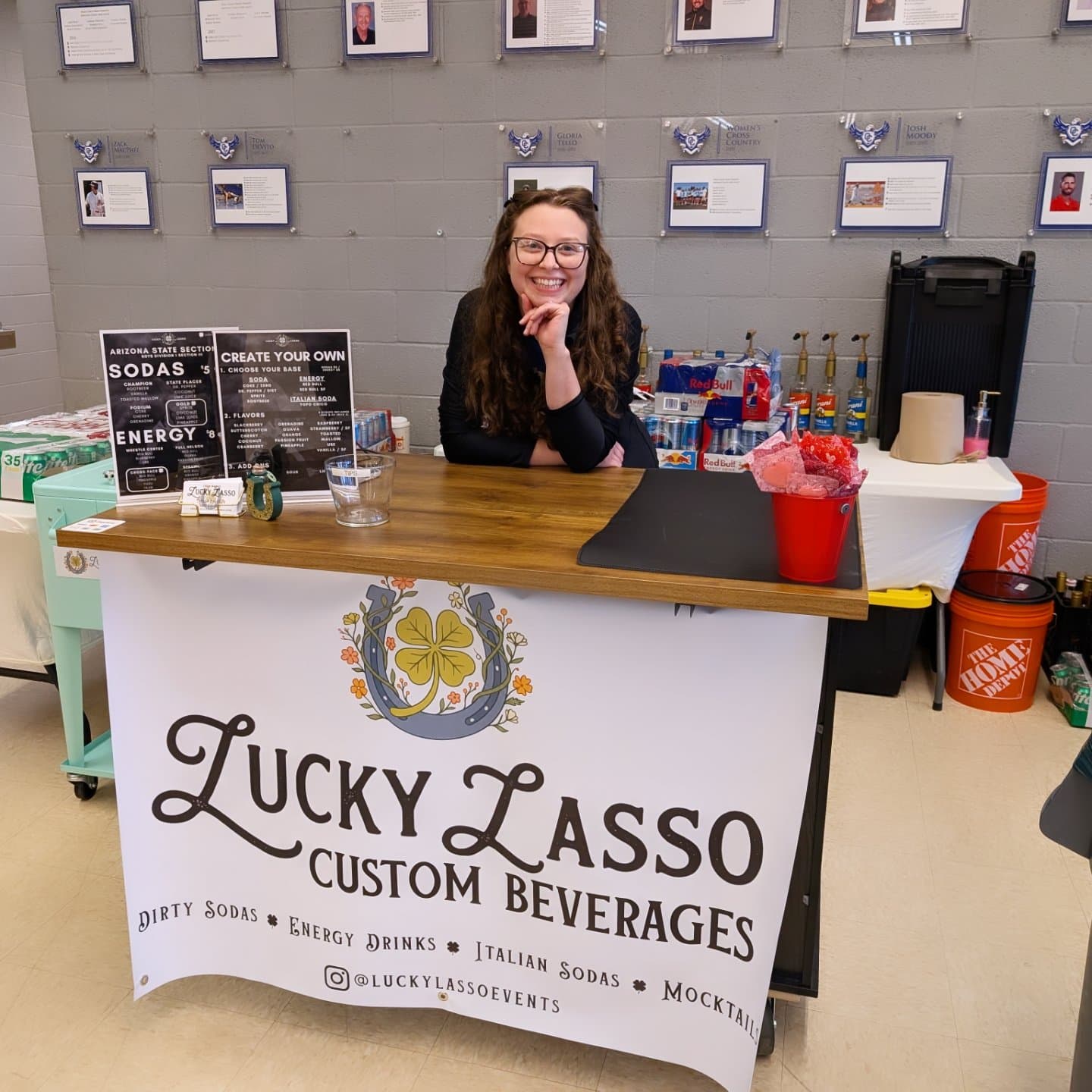 Taylor smiling behind the Lucky Lasso cart