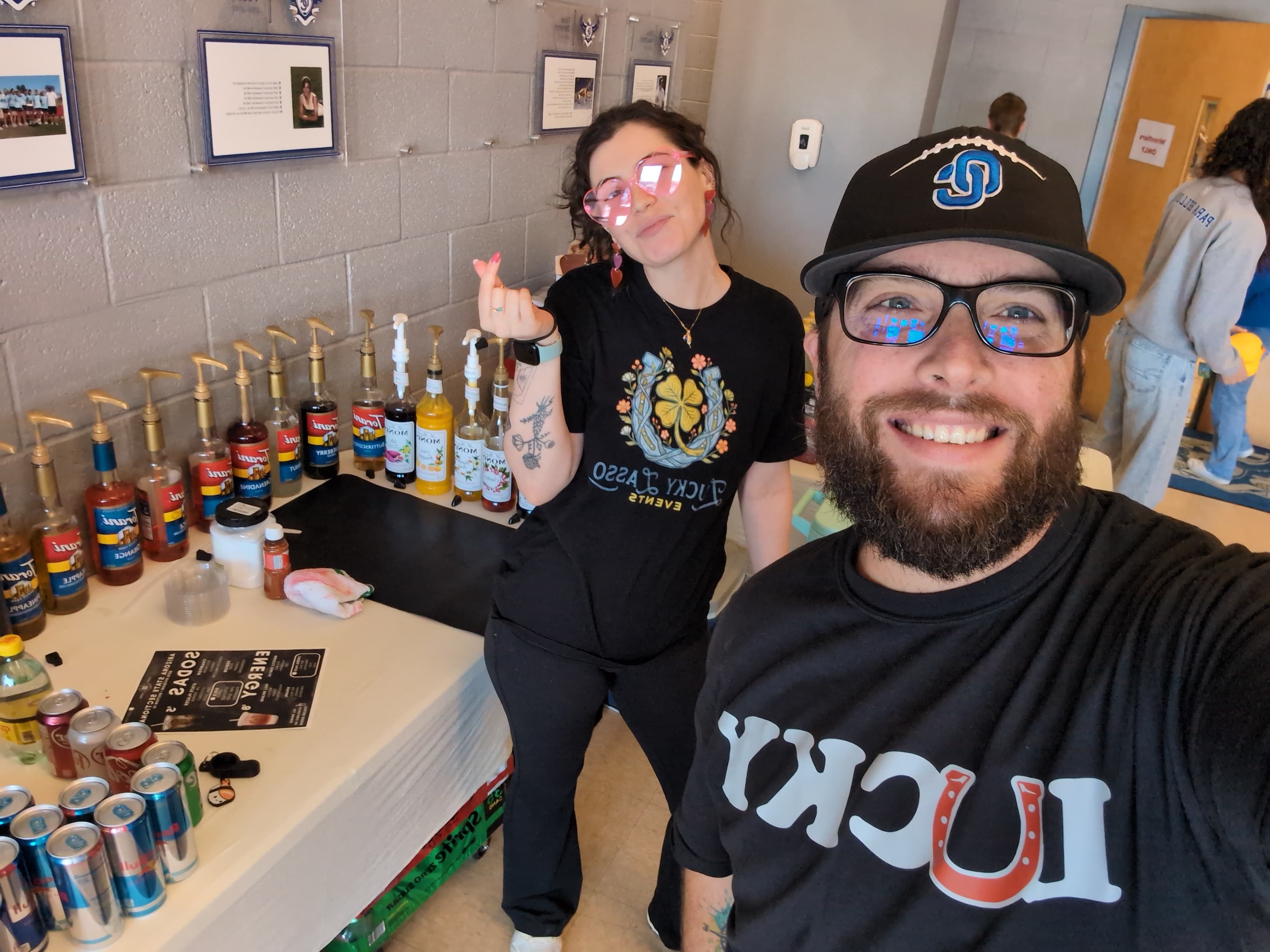 Taylor and Josh behind the Lucky Lasso booth