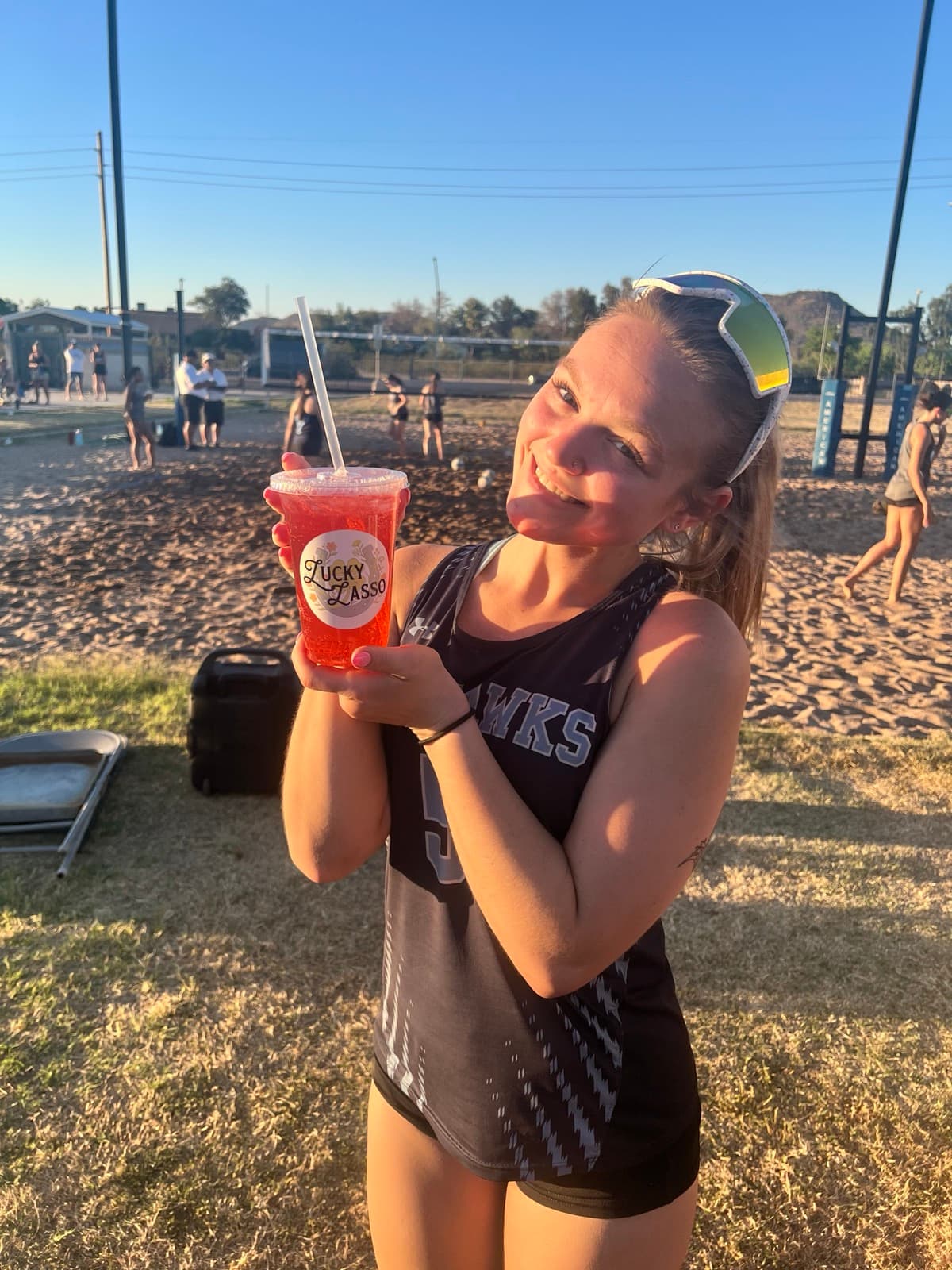 Happy customer showing off a Lucky Lasso branded cup